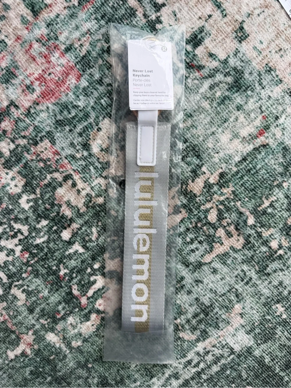 lululemon athletica Never Lost Keychain Lanyard in light grey with Gold Logo